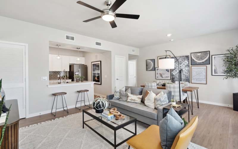 living room with white walls and a ceiling fan at Bainbridge Creekside in New Braunfels, TX